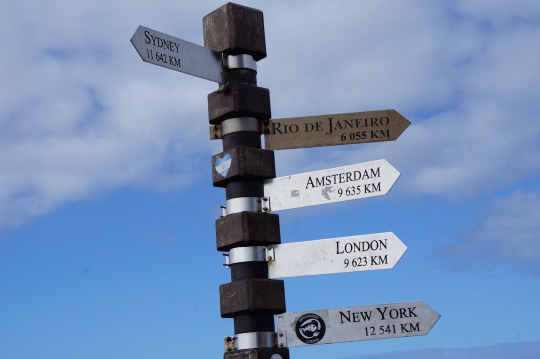brown-and-gray-road-street-signs-at-daytime-l5-za-iuuda
